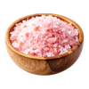 Wooden bowl filled with pink Himalayan salt crystals on a white background